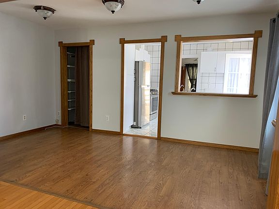 Large Eating Area/ Office Space with natural light from large window and storage closet