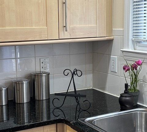 Marble countertops, stainless steel appliances, and sink