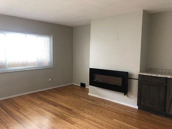 Living Room with fireplace and bar