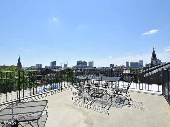 Huge rooftop deck with sweeping city view comes furnished - all you have to do is enjoy!