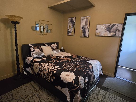 Over head storage. Under bed drawers and a ceiling fan