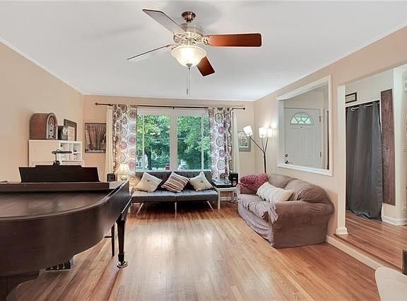 View from dining area toward living room with a lovely bay window (newly installed 2015).