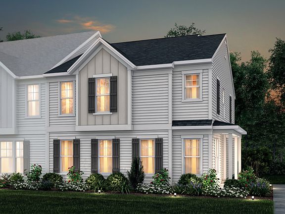 Sharon Exterior 22B features siding, covered front door and 2-car rear load garage