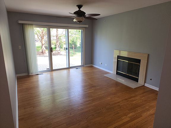Family room with wood burining fireplace. Gas light.