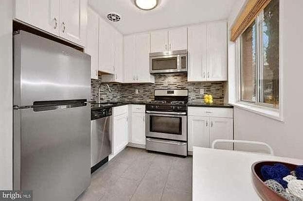 Remodeled kitchen with dishwasher, built in microwave and gas stove. Granite countertops and plenty of storage.