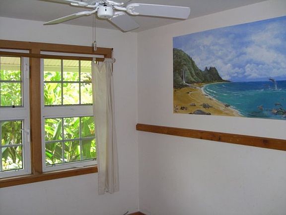 Bedroom with tropical mural