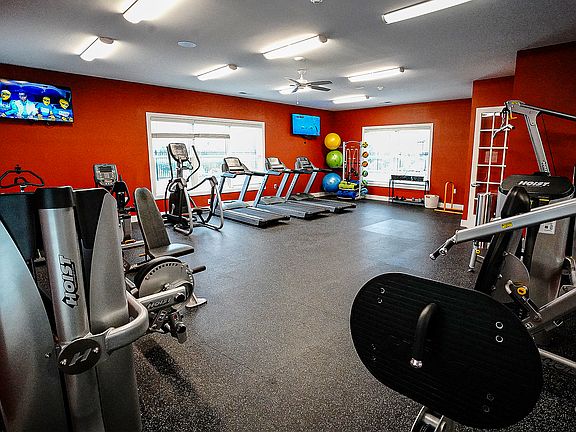 Get moving on your schedule _ our 24/7 fitness center has everything from treadmills to free weights, all just steps from your door.