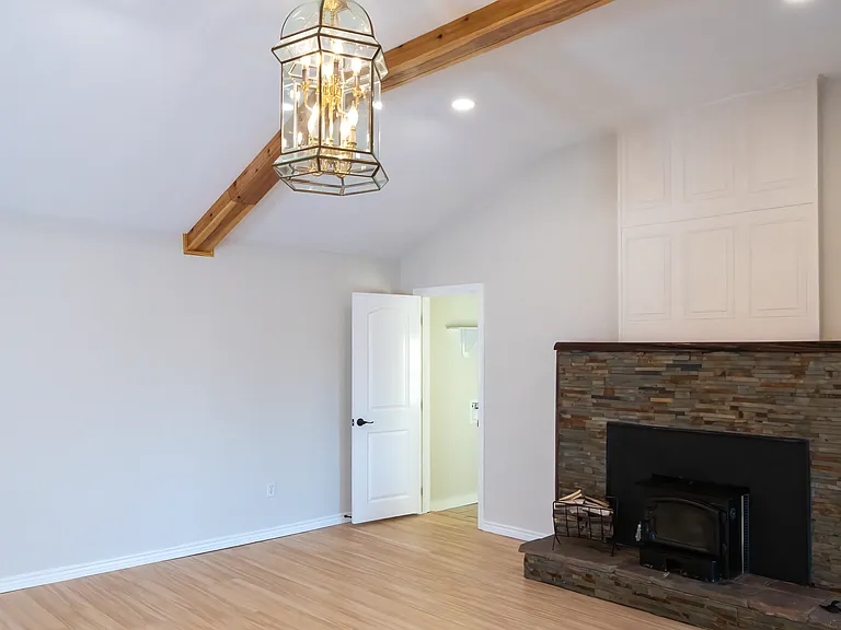 Open door leads to nice size utility room with space for extra fridge/freezer