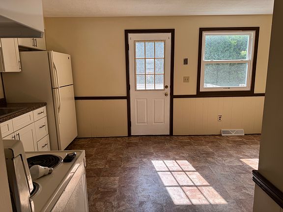 Door in kitchen leading to deck