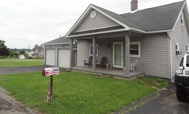 Great starter home.  Situated on level lot.  2 car detached garage.  I car detached garage on other side of house.