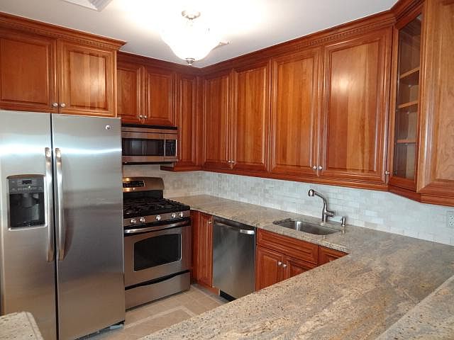 Modern Kitchen with Granite and Marble back Splash