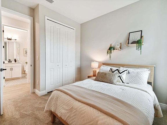 Sandpiper new construction luxury paired villa home plan bedroom 2 55 in Sun City Center, FL at Fai