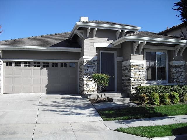 frontal view of house in quiet neighborhood