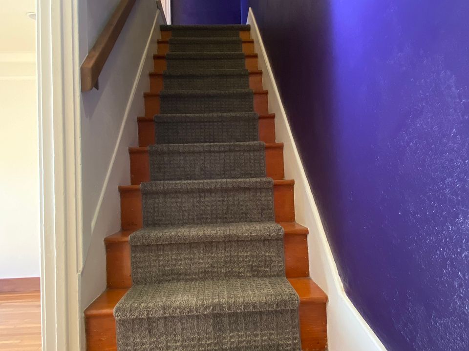 Stairs from Living room and Bathroom