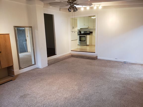 View from large bonus room into kitchen