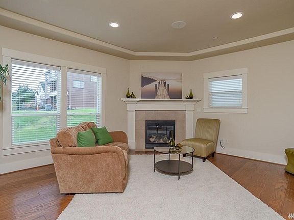First floor living space with gas fireplace. First floor also includes private office for taking virtual meetings in seclusion.