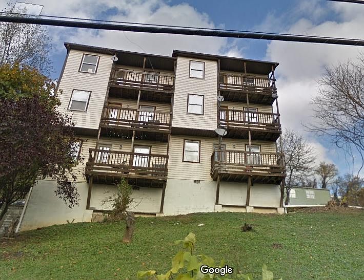 Full street view of house where apartment is located