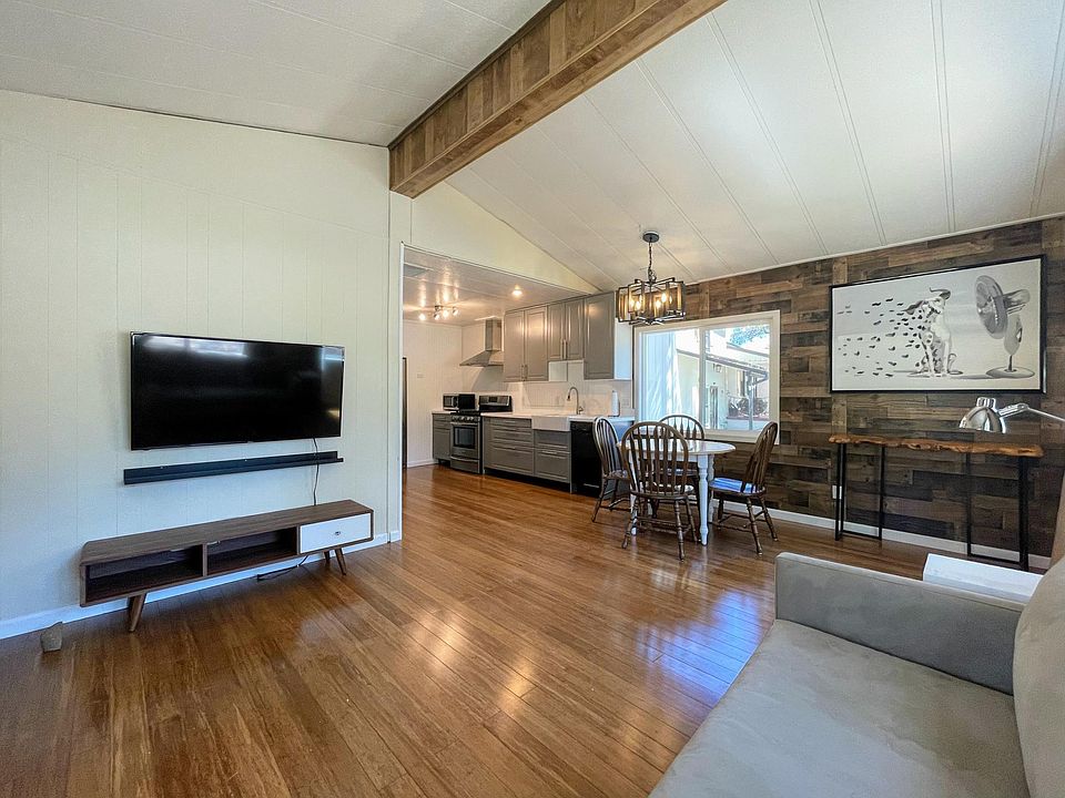 Open floor plan with enormous beautiful windows and bountiful natural light.