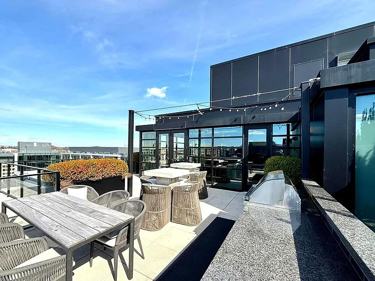 Rooftop terrace with premium grilling station and lounge