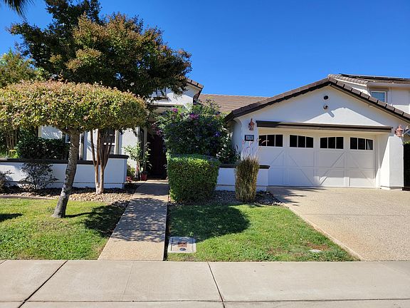 Freshly painted single-story house with two car garage
