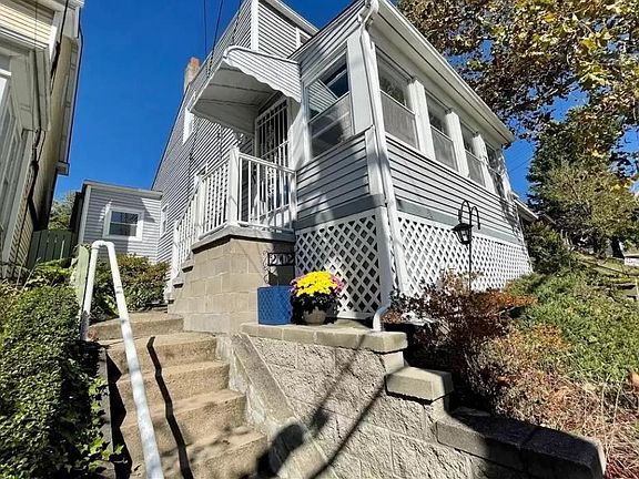 Covered stoop front entry.