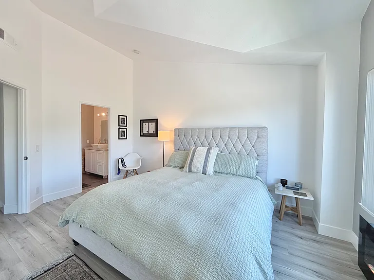 Primary Bedroom with fireplace & view