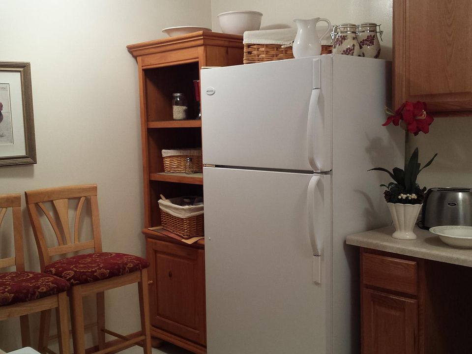 Refrigerator has freezer. All dishes and decorations, baking pans and dishes included.