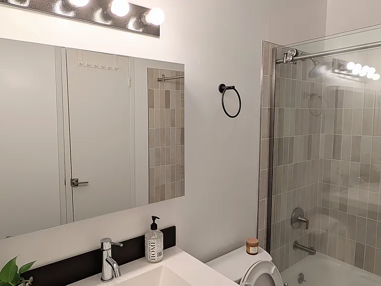 Bathroom with sliding glass door and tub