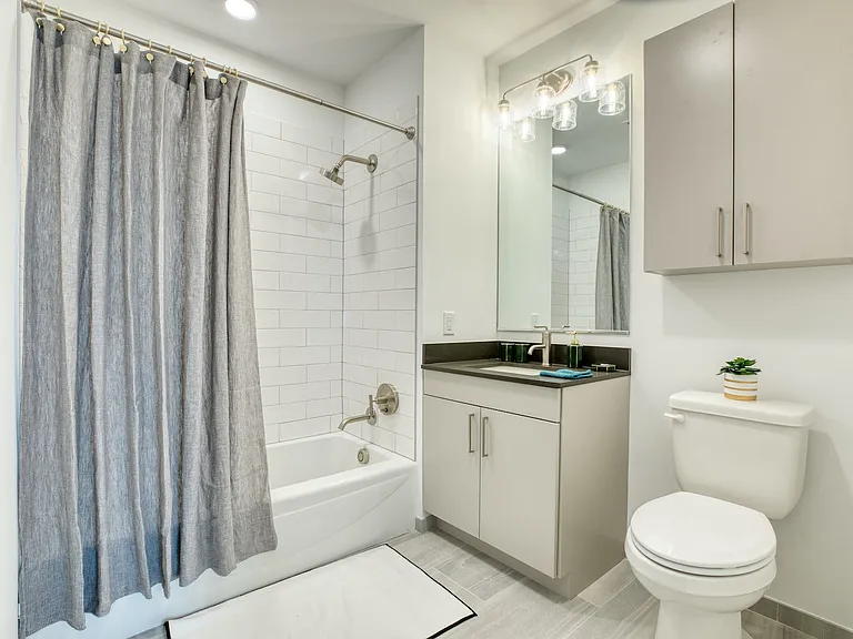 Elevate your living with stylish interiors at Hamilton Crossing Apartments. This modern bathroom features sleek finishes and ample storage, creating a serene retreat. Explore the comfort and convenience todaya"schedule a tour now!