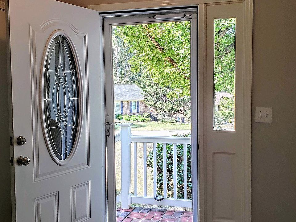 Welcome home! Freshly painted foyer into open dining room