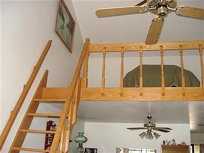 Loft with oak stairs and railing