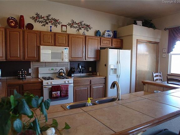 Kitchen has over whelming storage, walk out deck and views that are amazing.