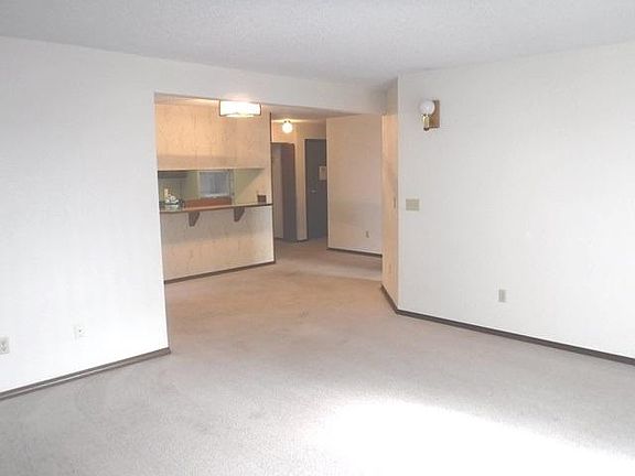 Opposite angle from Living Room towards Kitchen w/ breakfast bar