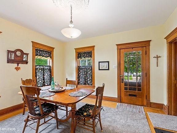 Lovely, decorative front doors, hardwood floors, abundant windows, and gorgeous woodwork!
