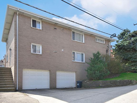 Off-street parking provided in the driveway and designated garage space at the side of the property.