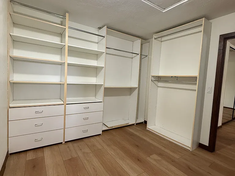Another view of the walk in closet in the primary bedroom.