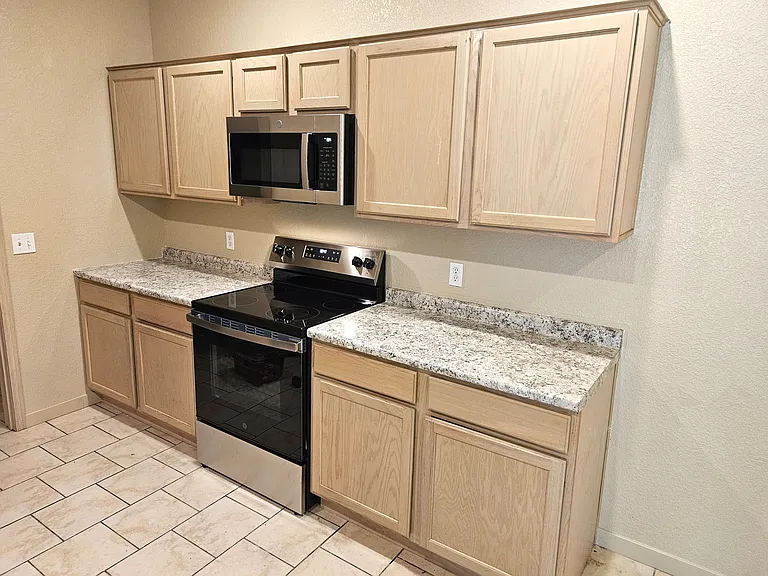 New stainless steel kitchen appliances and countertops