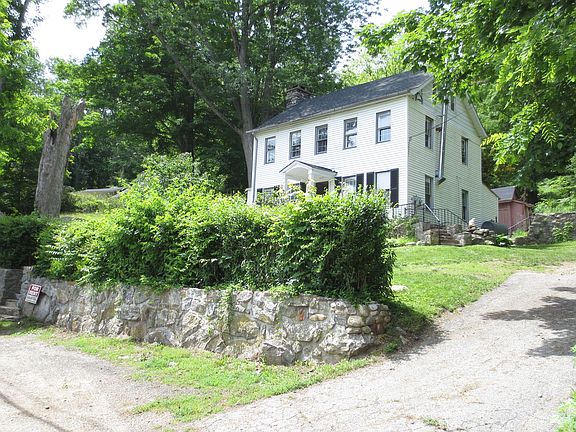 side of the house with parking