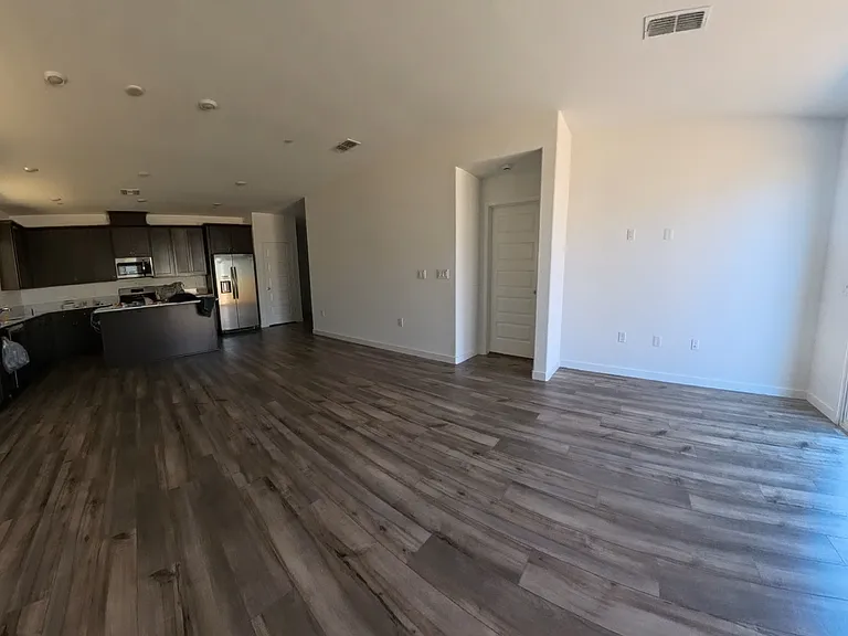 Open floor plan with a large living area and kitchen