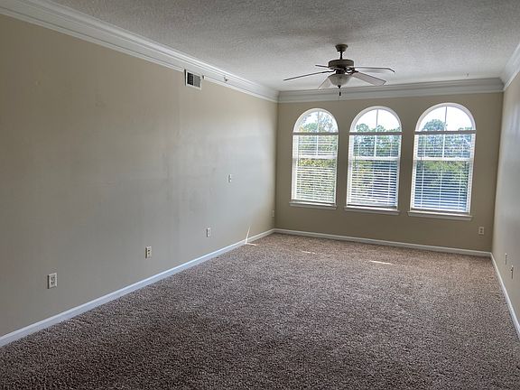 Large windows overlooking the pond