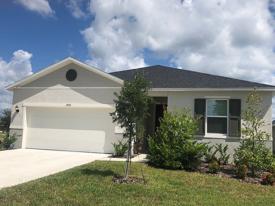 Welcome to 19931 Azul Marble Loop. There are motion detector floodlights with cameras on the front and back of the home.