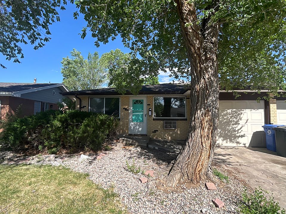 3120 driveway with storage space in half garage.