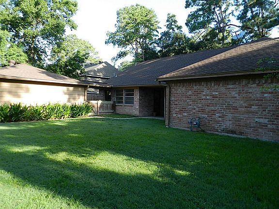 Large backyard with covered patio.