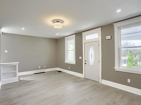 This is looking from the diningroom into the livingroom to the front door.
