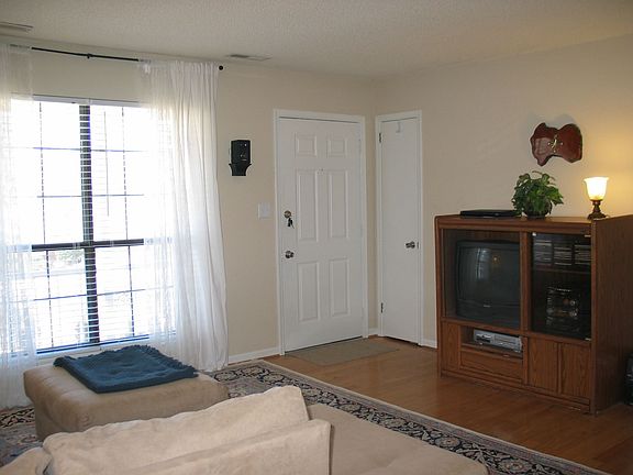 Living room with hardwoods, view of lovely front yard