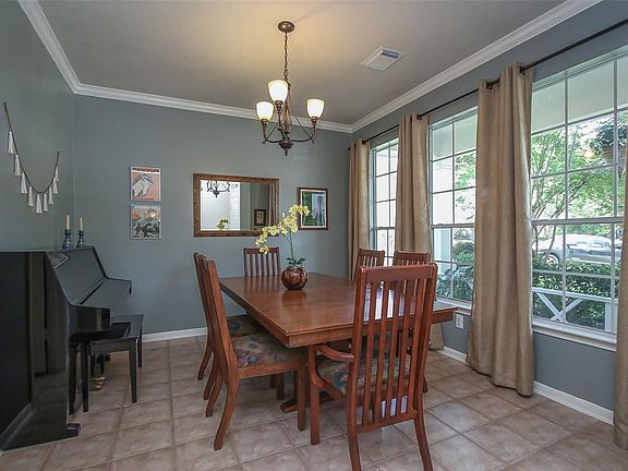 Crown Molding and Updated Chandelier Grace the Elegant Formal Dining Room.