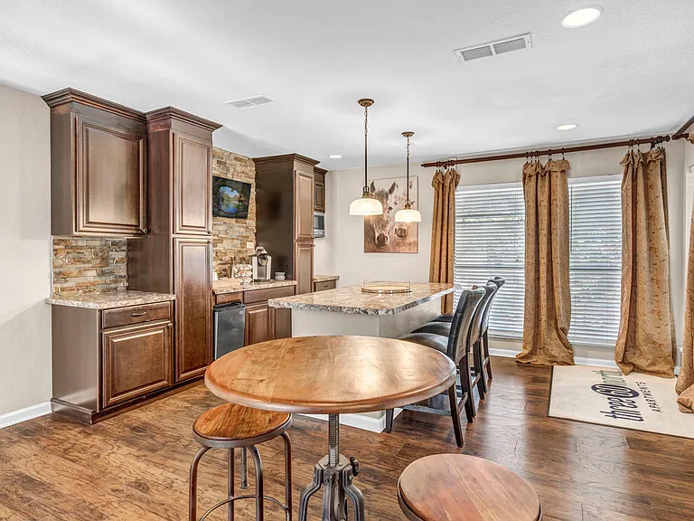 Elegant resident lounge with hardwood flooring and inviting atmosphere.