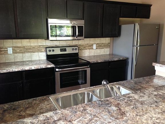 Kitchen with all upgraded Stainless Steel appliances and bac