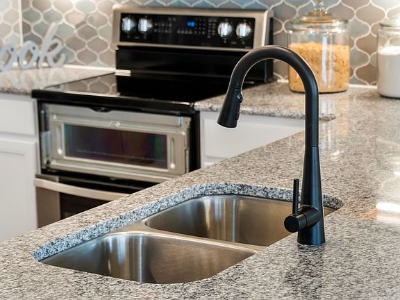 Dual-basin kitchen sink