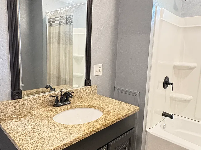 Framing around the mirror adds an extra touch of charm and character.